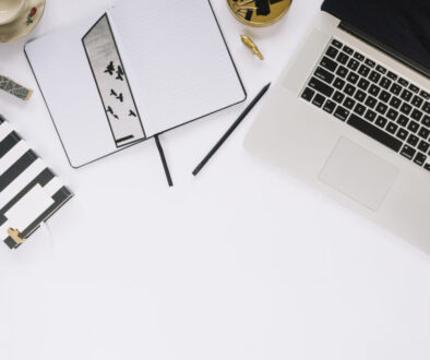 high-angle-view-laptop-stationeries-white-tabletop