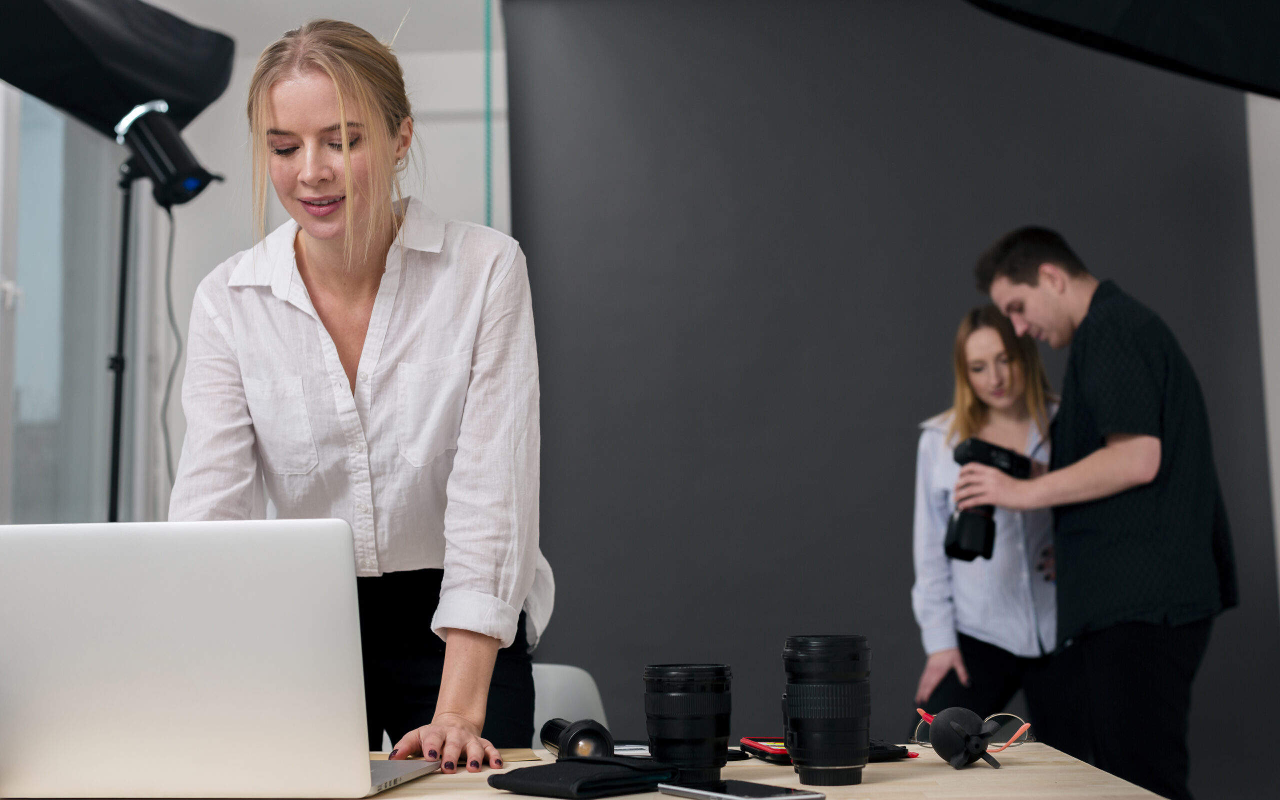 woman-working-laptop-people-looking-photos